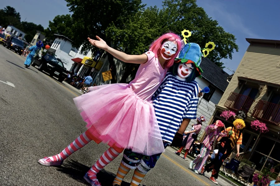 Two young clowns posing on the parade route
