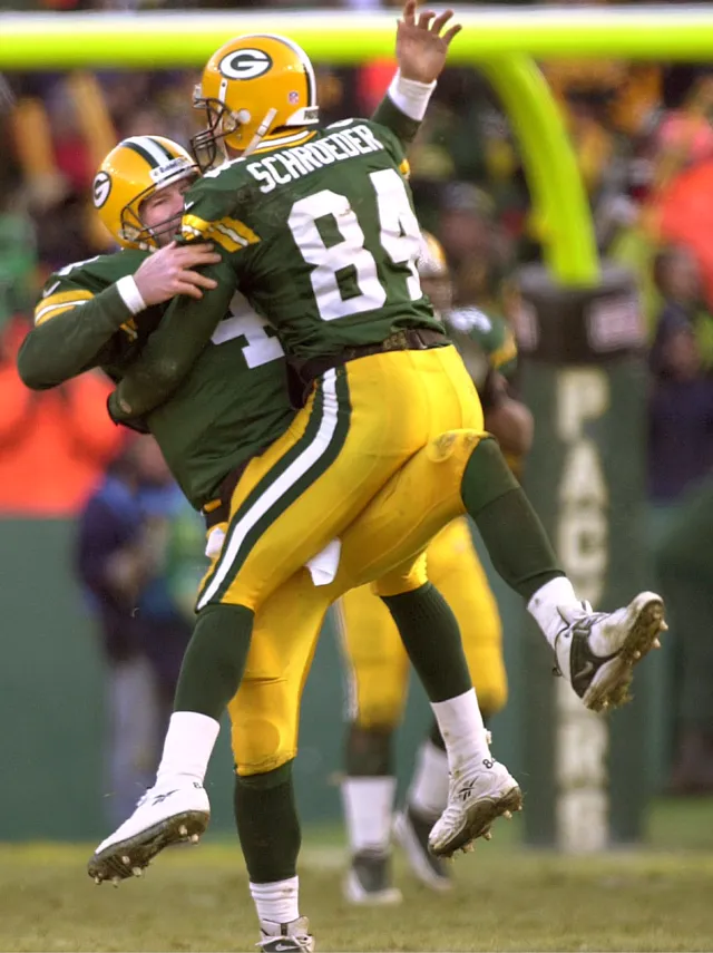 Green Bay Packers receiver Bill Schroeder, number 84, lifted in celebration after a touchdown at Lambeau Field